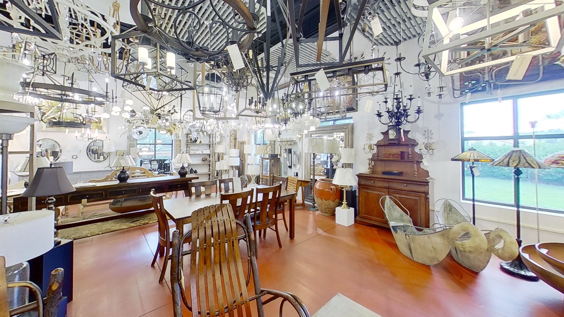 A working table under hanging fixtures on the High Point showroom floor