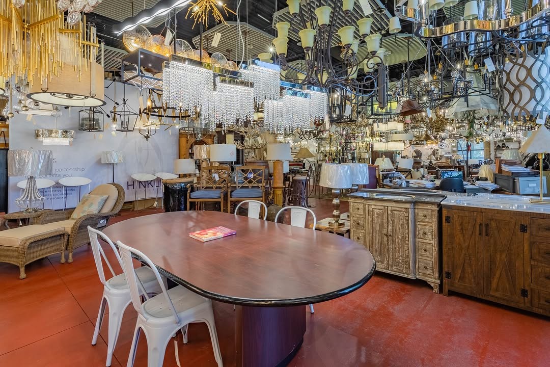 The Butler Lighting High Point showroom floor, with hanging fixtures around a sales table